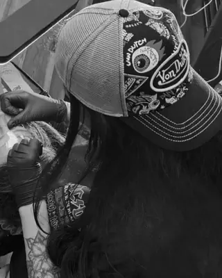 Ashley Rice at work at Satori Tattoo