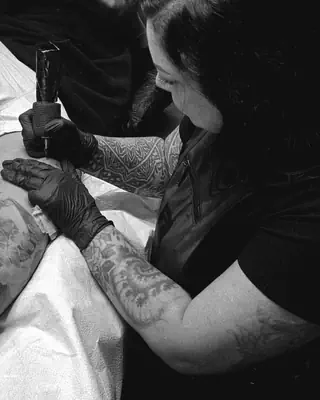 Chelsea Coronado at work at Satori Tattoo