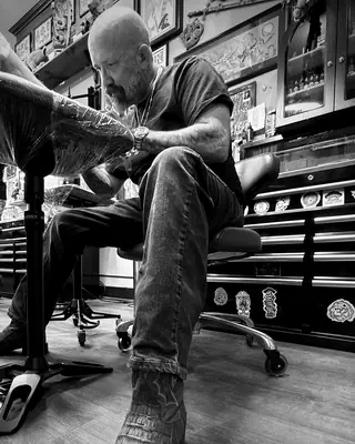 Chris Hummel at work at Satori Tattoo