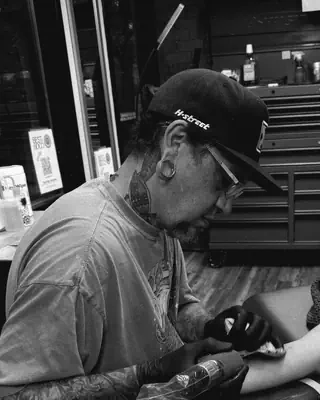 Jason Johnson at work at Satori Tattoo