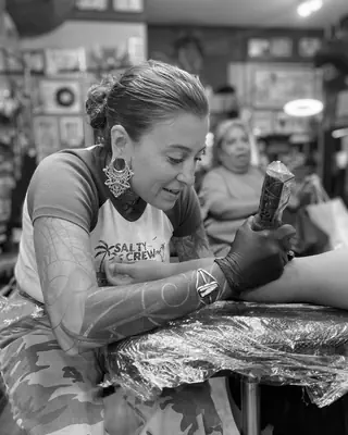 Kim Hummel at work at Satori Tattoo