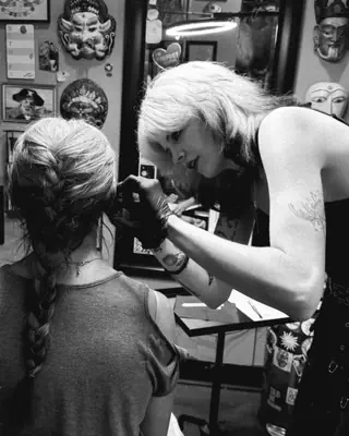 Lila Harris at work at Satori Tattoo