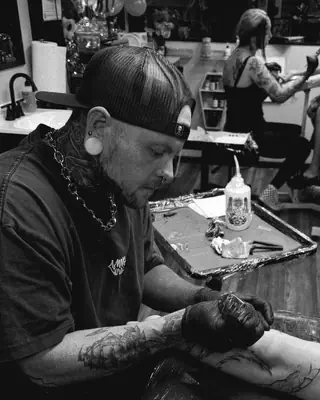 Shane McCarthy at work at Satori Tattoo