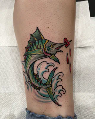 American traditional color marlin leaping from a wave, on a calf