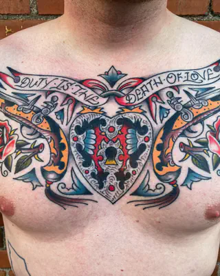 American traditional chest piece with crossed pistols, roses, a heart, and a banner across the chest
