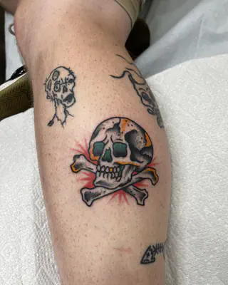 Traditional skull and crossbones with red highlights, on a calf