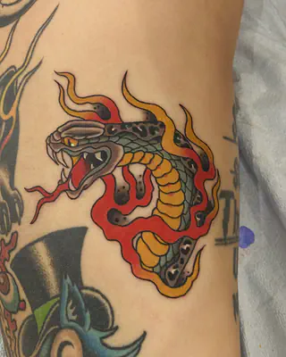 American traditional snake wrapped in red and yellow flames